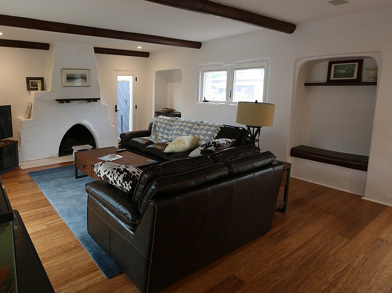 The renovated living room with a raised ceiling and brighter interior.